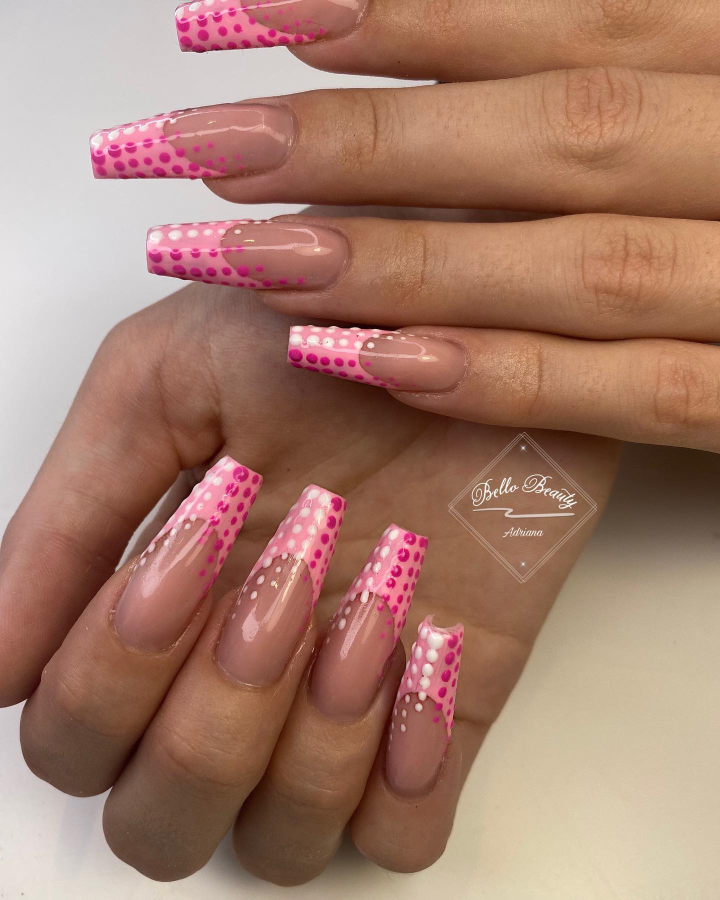Bright pink nail art with colorful confetti details